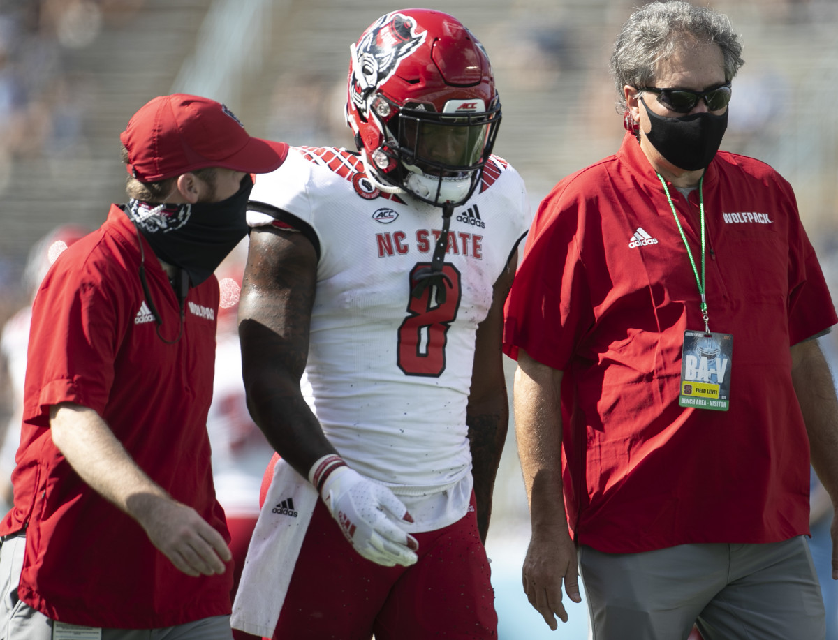 Ricky Person Jr. is helped off the field after suffering a concussion